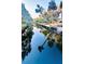 Stunning reflection of palm trees on calm canal waters at 69 E Bayshore Dr, Port Orange, FL 32127
