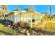 Renovated home with a screened porch, landscaped yard and a spacious walkway at 69 E Bayshore Dr, Port Orange, FL 32127