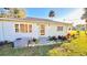Newly remodeled light blue home with a front porch and manicured landscaping at 69 E Bayshore Dr, Port Orange, FL 32127