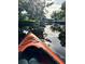 Kayaking through a peaceful canal, shaded by trees at 69 E Bayshore Dr, Port Orange, FL 32127