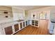 Updated kitchen with white cabinets, wood flooring, and ample counter space at 69 E Bayshore Dr, Port Orange, FL 32127