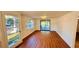Bright living room with wood-look floors and sliding glass doors at 69 E Bayshore Dr, Port Orange, FL 32127