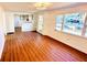 Spacious living room with wood-look floors and large windows at 69 E Bayshore Dr, Port Orange, FL 32127