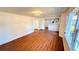 Spacious living area featuring wood-look floors and kitchen views at 69 E Bayshore Dr, Port Orange, FL 32127
