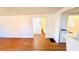 Open living area with wood-look floors and access to a bathroom at 69 E Bayshore Dr, Port Orange, FL 32127