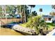 Picturesque waterfront view with canal, backyard, and lush landscaping at 69 E Bayshore Dr, Port Orange, FL 32127