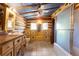 Rustic bathroom with log cabin walls and unique decor at 735 S Glencoe Rd, New Smyrna Beach, FL 32168