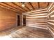 Bedroom with hardwood floors and log cabin walls at 735 S Glencoe Rd, New Smyrna Beach, FL 32168