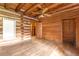 Cozy log cabin bedroom with hardwood floors and closet at 735 S Glencoe Rd, New Smyrna Beach, FL 32168