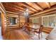 Spacious dining area with wood floors and built-in shelving at 735 S Glencoe Rd, New Smyrna Beach, FL 32168