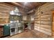 Rustic kitchen with stainless steel range and wood-beamed ceiling at 735 S Glencoe Rd, New Smyrna Beach, FL 32168