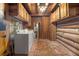 Cabin-style laundry room with brick flooring at 735 S Glencoe Rd, New Smyrna Beach, FL 32168