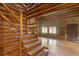 Spacious living room with stone fireplace and wood floors at 735 S Glencoe Rd, New Smyrna Beach, FL 32168