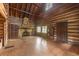 Living room features a stone fireplace and log cabin walls at 735 S Glencoe Rd, New Smyrna Beach, FL 32168