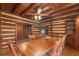 Unfinished log cabin storage area with built-in shelving at 735 S Glencoe Rd, New Smyrna Beach, FL 32168