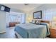 This cozy bedroom features ocean views and is tastefully decorated with coastal accents and a comfortable queen bed at 8 Ocean Dr, Ormond Beach, FL 32176