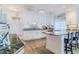 Bright kitchen featuring gray floors, white cabinets, and modern appliances at 8 Ocean Dr, Ormond Beach, FL 32176