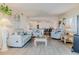 Living room with furniture, gray floors, and view to kitchen at 8 Ocean Dr, Ormond Beach, FL 32176