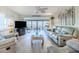 Cozy living room featuring gray floors, furniture, and a breathtaking beach view at 8 Ocean Dr, Ormond Beach, FL 32176