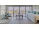 Bright living room with gray floors, beach view, furniture, and light green walls at 8 Ocean Dr, Ormond Beach, FL 32176