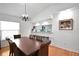 Bright dining room with a wood table and wicker chairs at 806 E 21St Ave, New Smyrna Beach, FL 32169