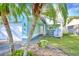 Home exterior with a white garage and spiral staircase at 806 E 21St Ave, New Smyrna Beach, FL 32169