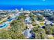 Stunning aerial view capturing a residential area near the beach, with mature trees and a glimpse of modern buildings at 808 E 19Th Ave, New Smyrna Beach, FL 32169