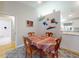 Comfortable dining area with colorful decor, adjacent to an open-concept kitchen at 808 E 19Th Ave, New Smyrna Beach, FL 32169