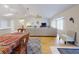 Spacious living room featuring wood floors, a ceiling fan, and natural light at 808 E 19Th Ave, New Smyrna Beach, FL 32169