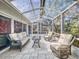 Enjoy this screened patio featuring plenty of seating, decor, and a translucent roof for lots of sunshine at 808 E 19Th Ave, New Smyrna Beach, FL 32169