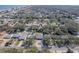 Aerial view showing location of property surrounded by mature trees in the neighborhood at 817 E 12Th Ave, New Smyrna Beach, FL 32169