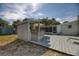 This backyard features an outdoor kitchen and dining space with a screened in porch area at 817 E 12Th Ave, New Smyrna Beach, FL 32169