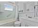 Clean bathroom with updated fixtures, ample storage, and a shower/tub combo with grab bar at 817 E 12Th Ave, New Smyrna Beach, FL 32169