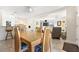 View of dining area with seating for four, opens to kitchen and living spaces at 817 E 12Th Ave, New Smyrna Beach, FL 32169