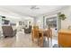 Bright open dining room with front door and living area view at 817 E 12Th Ave, New Smyrna Beach, FL 32169