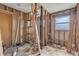 Unfinished bathroom with exposed plumbing and framing at 904 Wilkins St, New Smyrna Beach, FL 32168