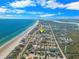 Aerial view showcasing home's location near the beach at 91 Maura Ter, Ponce Inlet, FL 32127