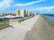 Aerial view of beachfront property with ocean and building at 91 Maura Ter, Ponce Inlet, FL 32127