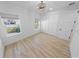 Bright bedroom with light wood floors, large closet, and window views at 91 Maura Ter, Ponce Inlet, FL 32127