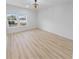 Spacious bedroom featuring light wood floors and a modern chandelier at 91 Maura Ter, Ponce Inlet, FL 32127