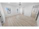 Bright bedroom featuring wood-look floors and ample natural light at 91 Maura Ter, Ponce Inlet, FL 32127