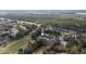 A beautiful aerial view of the property near the golf course, showcasing lush greenery and the neighborhood at 958 Beach Fern Ct, New Smyrna Beach, FL 32168