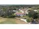 A panoramic view of the home and neighborhood highlights the meticulously maintained golf course at 958 Beach Fern Ct, New Smyrna Beach, FL 32168