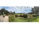 Panoramic view of the lush backyard featuring a well-manicured lawn and colorful landscaping at 958 Beach Fern Ct, New Smyrna Beach, FL 32168