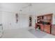 Bedroom with carpet floor, standard closet, and dark wood built-in desk and storage at 958 Beach Fern Ct, New Smyrna Beach, FL 32168