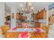 Bright kitchen open to dining room, showcasing custom wood cabinetry and stainless appliances at 958 Beach Fern Ct, New Smyrna Beach, FL 32168