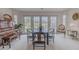 Cozy dining area featuring ample windows, a neutral color palette, and view of backyard at 958 Beach Fern Ct, New Smyrna Beach, FL 32168