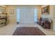 Inviting foyer with bright tile flooring, elegant double doors, and a welcoming atmosphere at 958 Beach Fern Ct, New Smyrna Beach, FL 32168