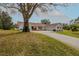 Charming single-story home with a well-manicured lawn and inviting front entrance at 958 Beach Fern Ct, New Smyrna Beach, FL 32168