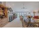 Airy living room with a fireplace, lots of natural light, and ample seating space at 958 Beach Fern Ct, New Smyrna Beach, FL 32168